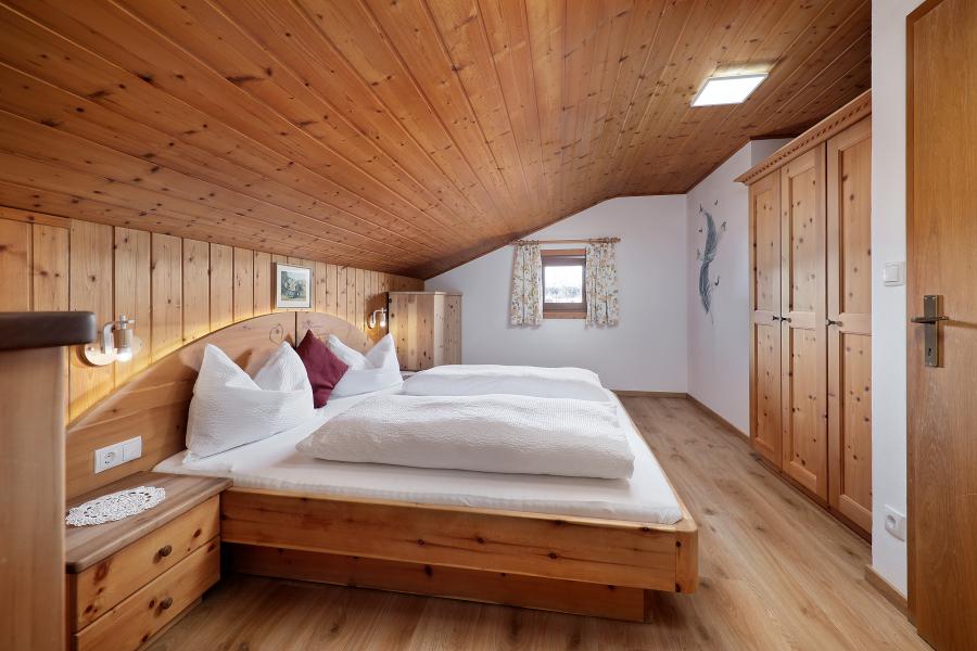 Ferienwohnung - Schlafzimmer mit einem Doppelbett